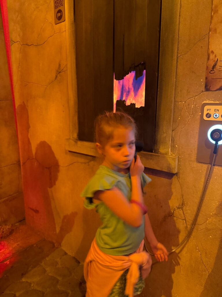 A visitor at an interactive station inside QUAKE